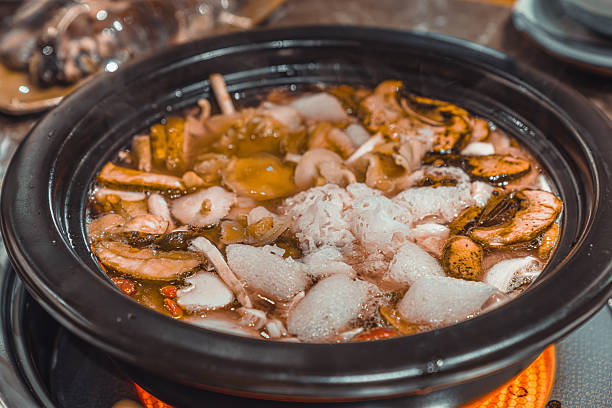 Yunnan traditional food. Mushroom chicken soup hotpot.